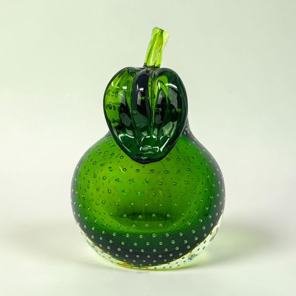 A heavy emerald green glass pear with a clear stem and leaf. The interior is filled with a uniform pattern of tiny air bubbles. It has a flat base and a secondary flat side for angled display.
